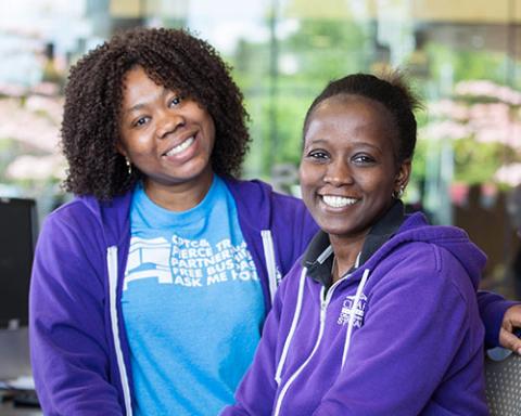 two students at slsc front desk