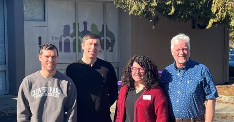 4 people standing on the clover park campus